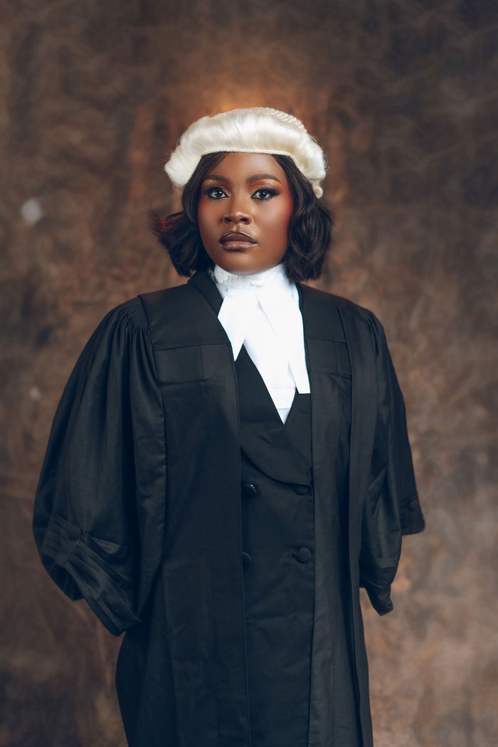 Crafting Captivating Headlines: Your awesome post title goes here Confident young female lawyer in a traditional gown and wig.