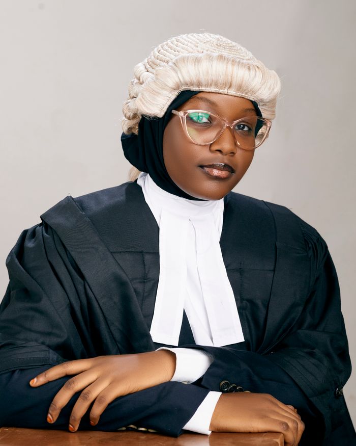 Mastering the First Impression: Your intriguing post title goes here Portrait of a confident female lawyer wearing a wig and gown in a studio setting in Kano, Nigeria.