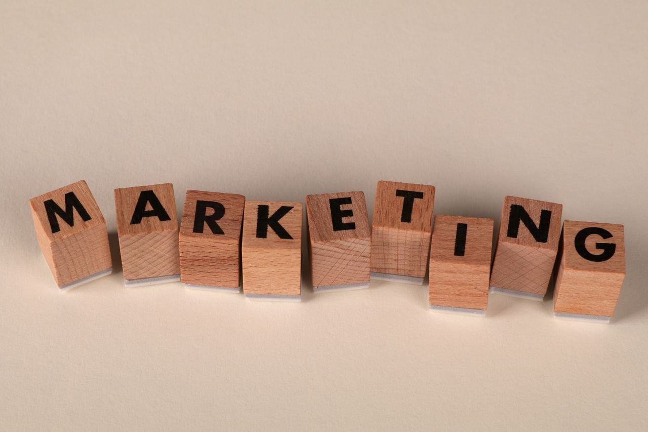 Home Wooden blocks with letters spelling 'marketing', ideal for business and advertising visuals.