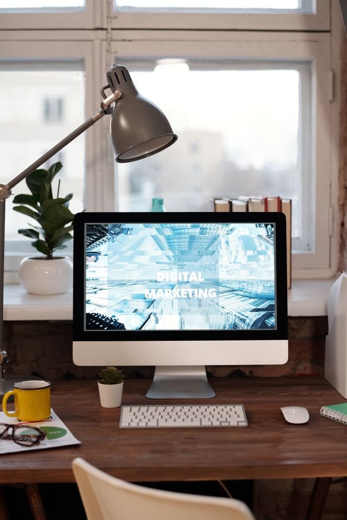 Services Contemporary home office desk with digital marketing screen, perfect for remote work inspiration.